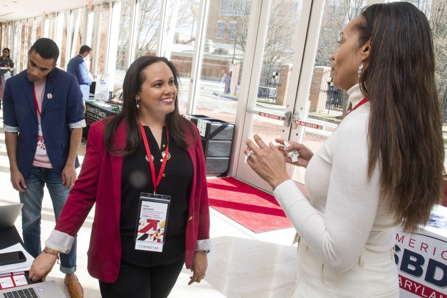 Photo of two people talking at a career and networking event