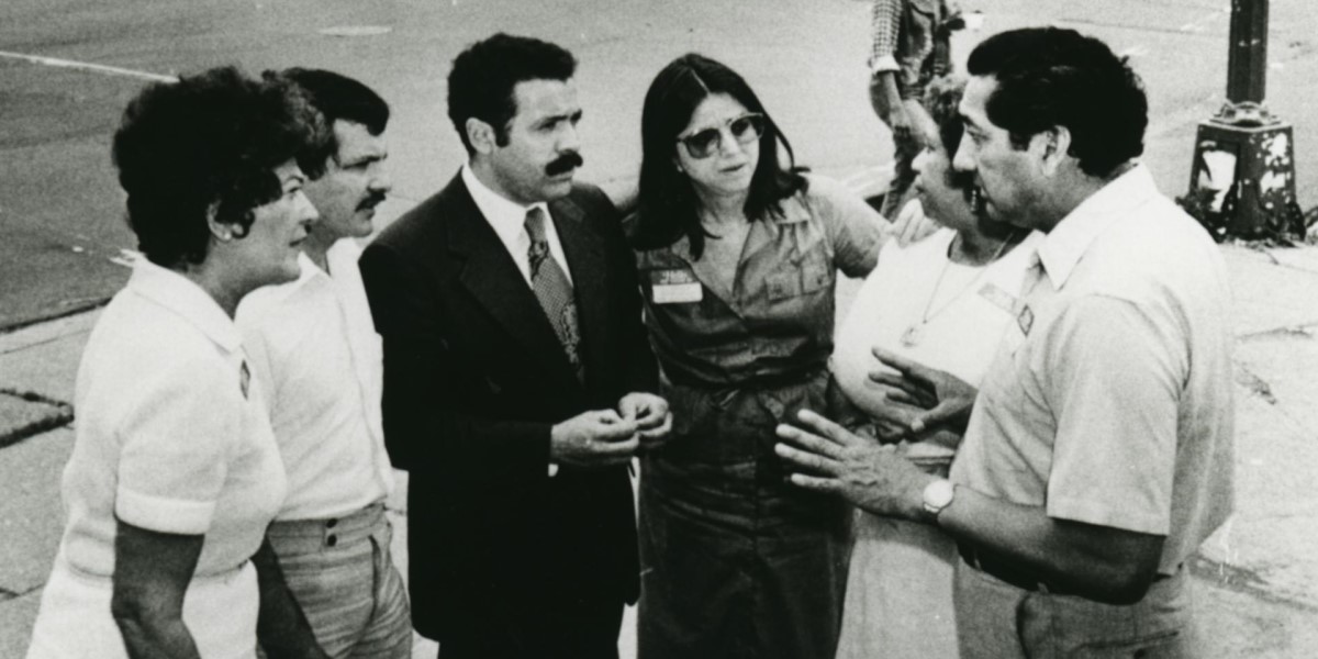 Casilda Luna, second from right, in conversation with a group in Washington, DC's Columbia Heights neighborhood, c. 1970s.