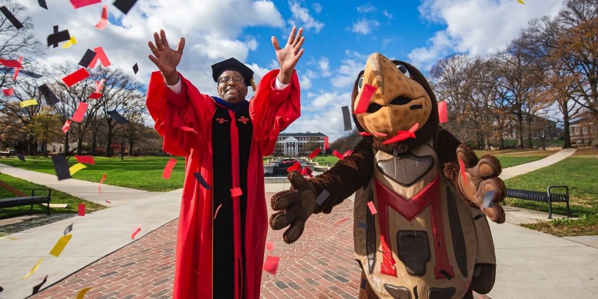 Photo of Darryll Pines and Testudo throwing confetti