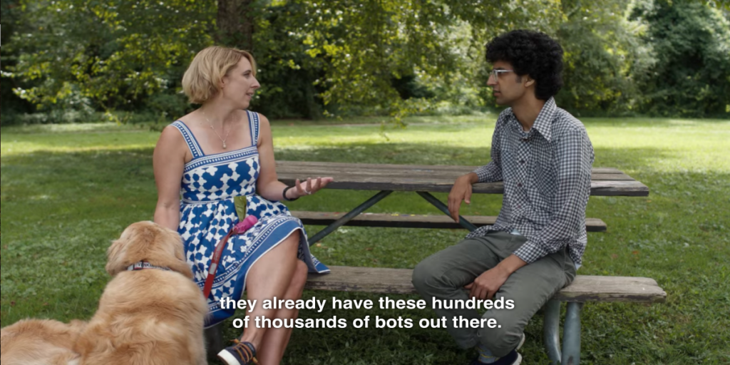 photo of man and woman sitting on a bench with a golden retriever standing by the woman with a caption over the photo that reads "they already have these hundreds of thousands of bots out there"