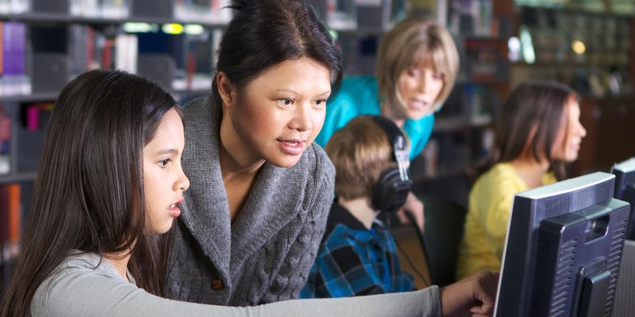 Children using computers in a library