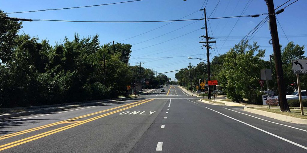 PG County Road which a blue sky in the background