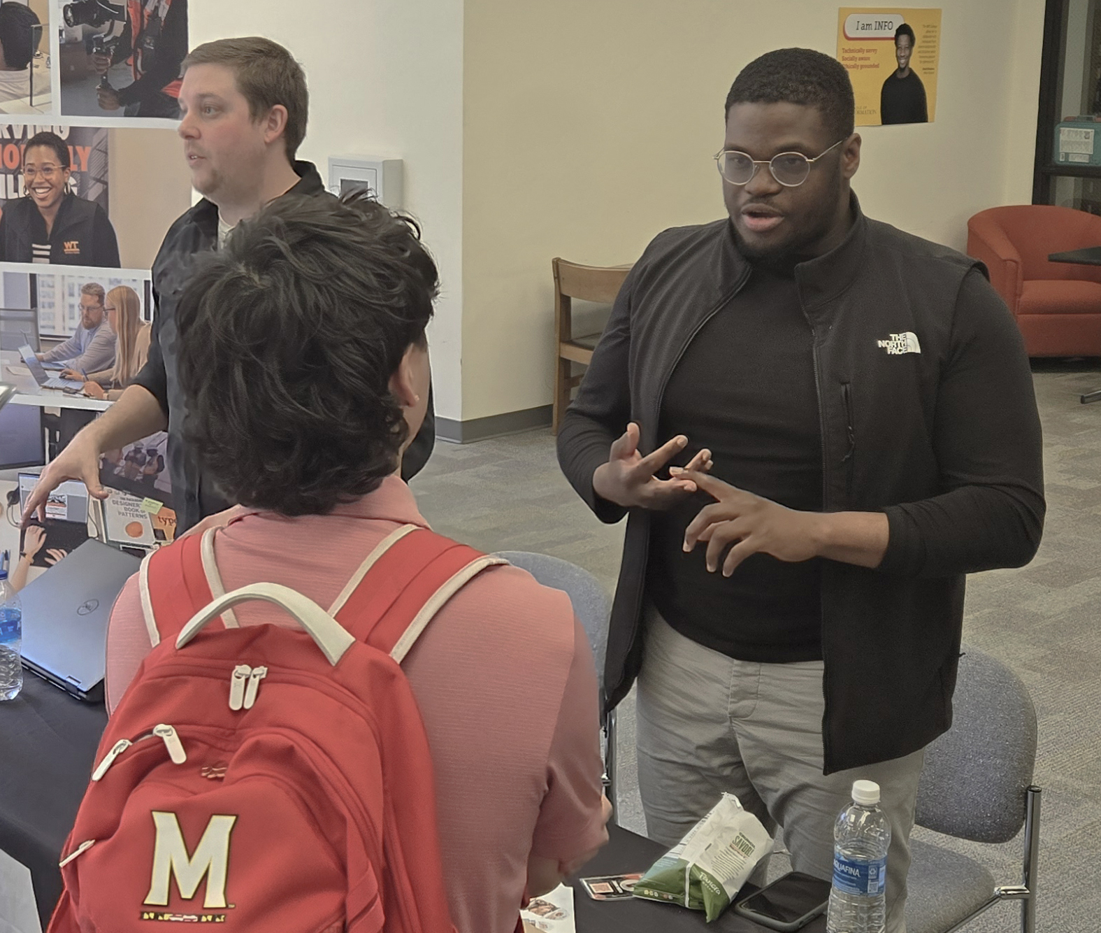 Industry partner talking to student at career fair