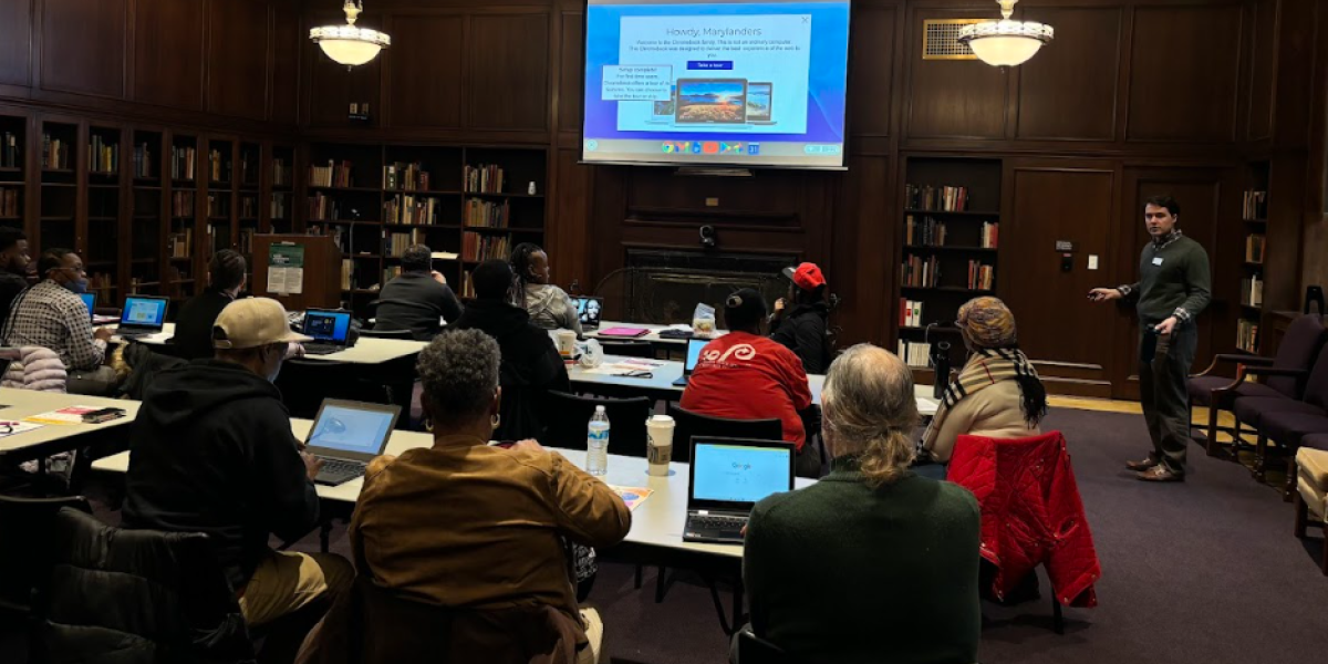 Photo of people in a classroom setting at the Enoch Pratt Library in Baltimore, receiving training