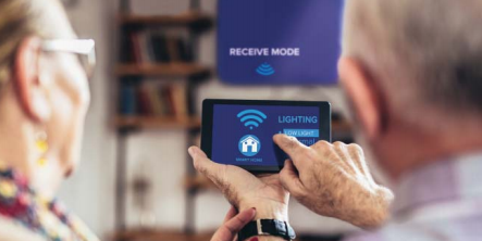 Older adults using smart home technology on a tablet