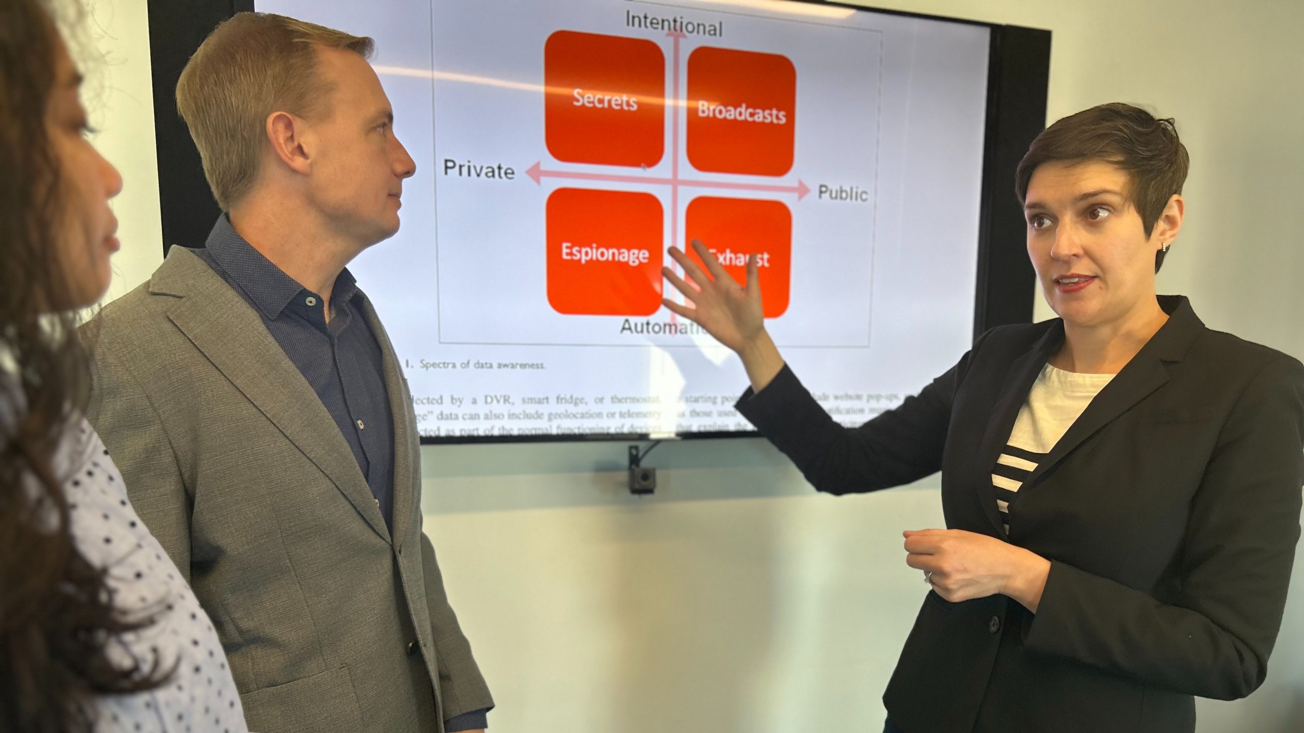 (From left) University of Maryland doctoral student Lovely-Frances Domingo, Professor Hal Daumé III and Associate Professor Katie Shilton discuss some of Shilton’s work on ethics and policy for the design of information technologies. Daumé and Shilton are helping lead the new $20M NSF Institute for Trustworthy AI in Law & Society. Credit: Maria Herd