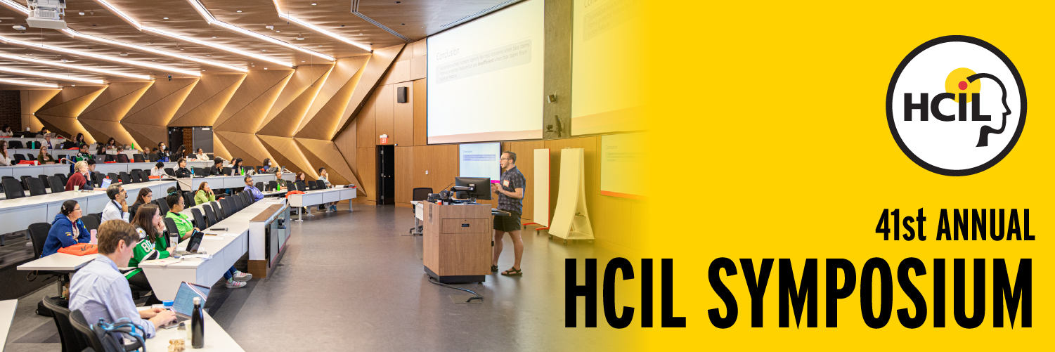 Photo of a presentation to a room of people from a prior HCIL Symposium event