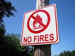 No fires sign on wooden post