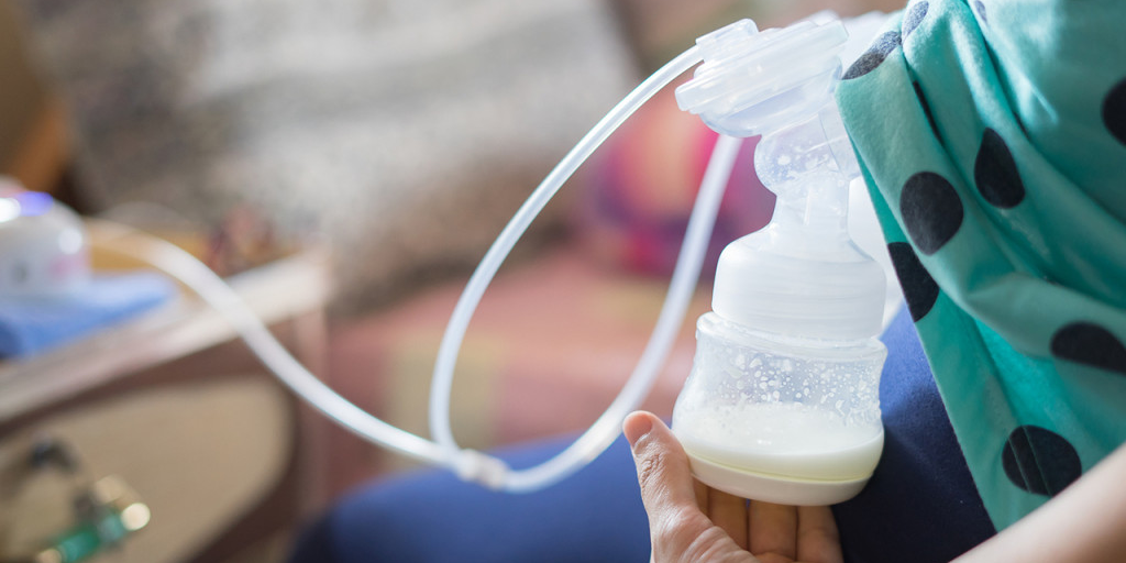 Woman breast pumping