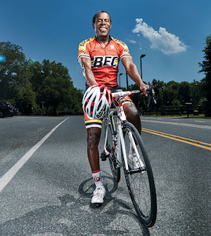 man on a bike smiling