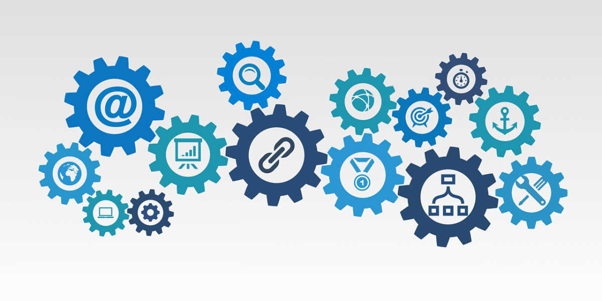 graphic of gears with elements inside of them like an @ symbol, magnifying glass, paper clip, and anchor