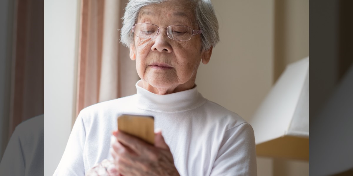 Photo of a senior woman holding a smart phone